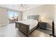 Spacious main bedroom with a ceiling fan, access to a private patio, and wood-look flooring at 9130 Haddington Ln, Las Vegas, NV 89145