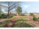 Community park with walking path, benches, mature trees, and manicured landscaping at 9130 Haddington Ln, Las Vegas, NV 89145
