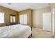 Bedroom featuring a queen-size bed with bright natural lighting and closet at 9432 Victory Garden Ave, Las Vegas, NV 89149