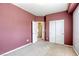 This bedroom features colored walls, carpet, and a closet with sliding doors at 9432 Victory Garden Ave, Las Vegas, NV 89149
