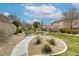 Inviting community park with benches, stone accents, and manicured greenery offering a peaceful outdoor space at 9432 Victory Garden Ave, Las Vegas, NV 89149