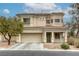 Beautiful home with a well-manicured front yard, a two car garage and a tile roof at 9432 Victory Garden Ave, Las Vegas, NV 89149