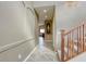 Inviting hallway with neutral tones, leading to a naturally lit living area at 9432 Victory Garden Ave, Las Vegas, NV 89149