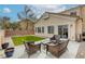 Private outdoor patio perfect for relaxation featuring comfortable seating and a lush green patch at 9432 Victory Garden Ave, Las Vegas, NV 89149