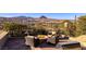 Outdoor seating area with fire pit and views of mountains and Lake Las Vegas at 10 Via Potenza Ct, Henderson, NV 89011