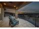Balcony with a beautiful sunset view, stone pillar, and two chairs at 10 Via Potenza Ct, Henderson, NV 89011