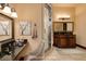 This bathroom features dual sinks, a walk-in shower, vanity, and decor at 10 Via Potenza Ct, Henderson, NV 89011