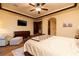 Relaxing bedroom with a large bed, wood dresser, and cozy furniture at 10 Via Potenza Ct, Henderson, NV 89011