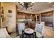 Cozy kitchen dining area featuring custom wood cabinets and stainless appliances at 10 Via Potenza Ct, Henderson, NV 89011