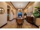 Traditional dining room with a large table, chandelier, and neutral wall colors at 10 Via Potenza Ct, Henderson, NV 89011