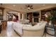 Elegant living room with a fireplace, built-in shelves, and a staircase at 10 Via Potenza Ct, Henderson, NV 89011