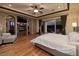 Spacious main bedroom with a fireplace and scenic views from the open sliding doors at 10 Via Potenza Ct, Henderson, NV 89011