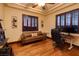 Home office with hardwood floors, natural light, and a comfortable workspace at 10 Via Potenza Ct, Henderson, NV 89011