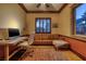 This office features a desk, couch, area rug, and large window providing natural light at 10 Via Potenza Ct, Henderson, NV 89011