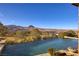 Beautiful infinity pool with desert mountain views, set against a clear blue sky at 10 Via Potenza Ct, Henderson, NV 89011