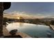 Luxury infinity pool with scenic mountain views at sunset at 10 Via Potenza Ct, Henderson, NV 89011