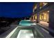 Backyard oasis featuring a sparkling pool, relaxing hot tub, and scenic views, perfect for outdoor enjoyment at 10 Via Potenza Ct, Henderson, NV 89011