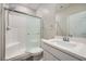 Bright bathroom with a shower featuring glass door and white subway tile surround at 10173 Skye Saddle Ave, Las Vegas, NV 89166