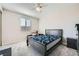 Bedroom featuring carpeted floors, a ceiling fan, and a window with blinds at 10173 Skye Saddle Ave, Las Vegas, NV 89166