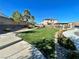 Neighborhood park with manicured lawn, garden areas, walking paths, and a community pergola at 10173 Skye Saddle Ave, Las Vegas, NV 89166