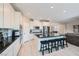 Beautiful kitchen featuring white cabinets, stainless steel appliances, black granite countertops and a center island at 10173 Skye Saddle Ave, Las Vegas, NV 89166