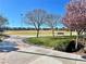 Beautiful park featuring walking paths, green space, mature trees, and seating, perfect for enjoying the outdoors at 10173 Skye Saddle Ave, Las Vegas, NV 89166