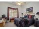 Comfortable bedroom with a bed, nightstands, TV, and window with decorative valance at 10401 Sea Palms Ave, Las Vegas, NV 89134