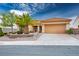 Charming single-story home featuring desert landscaping, a spacious driveway, and a two-car garage at 10401 Sea Palms Ave, Las Vegas, NV 89134