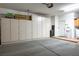 Spacious garage with ample storage cabinets along the wall and clean concrete floor at 10401 Sea Palms Ave, Las Vegas, NV 89134