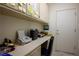 Office space features built-in cabinets and desk, perfect for work or study at 10401 Sea Palms Ave, Las Vegas, NV 89134
