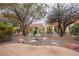 Charming patio features a fountain, chairs, and landscaping, offering a serene outdoor space at 10401 Sea Palms Ave, Las Vegas, NV 89134