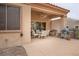 Comfortable covered patio area, perfect for outdoor dining and relaxation with shade and seating at 10401 Sea Palms Ave, Las Vegas, NV 89134