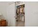 View of walk-in closet that is well-organized with shelving, hanging rods, and a ladder at 10401 Sea Palms Ave, Las Vegas, NV 89134