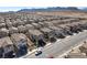 An aerial view of the neighborhood, close to mountains, featuring modern two story homes at 10619 Carnes Ave, Las Vegas, NV 89166