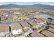 Sweeping aerial shot of a new housing development surrounded by scenic mountain views at 10619 Carnes Ave, Las Vegas, NV 89166