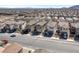 An aerial shot showcasing the roof and surrounding neighborhood homes at 10619 Carnes Ave, Las Vegas, NV 89166