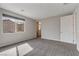 Bright bedroom with neutral carpet, natural lighting, and spacious open plan at 10619 Carnes Ave, Las Vegas, NV 89166
