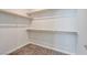 Walk-in closet with ample storage space and shelving ready for organization at 10619 Carnes Ave, Las Vegas, NV 89166