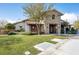 Charming clubhouse featuring stone accents, lush landscaping, and a welcoming entrance at 10619 Carnes Ave, Las Vegas, NV 89166