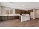 Bright kitchen features modern appliances, a center island, and sleek countertops at 10619 Carnes Ave, Las Vegas, NV 89166