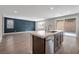 Spacious open-plan kitchen with a large island and modern stainless steel appliances at 10619 Carnes Ave, Las Vegas, NV 89166