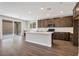 Bright kitchen showcases an island, modern appliances, and sliding glass doors at 10619 Carnes Ave, Las Vegas, NV 89166