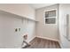 Dedicated laundry room with ample storage, natural light, and modern appliances at 10619 Carnes Ave, Las Vegas, NV 89166
