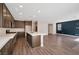 Open living space with eat in kitchen, wood-look floors and modern finishes at 10619 Carnes Ave, Las Vegas, NV 89166