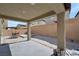 Covered patio area with concrete flooring and ample space for outdoor seating and entertaining at 10619 Carnes Ave, Las Vegas, NV 89166