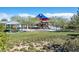Community playground offers a fun area with covered seating, a play structure, and green space at 10619 Carnes Ave, Las Vegas, NV 89166