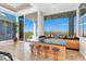 Modern bar area featuring sleek countertops, stylish seating, and expansive windows with city views at 1484 Macdonald Ranch Dr, Henderson, NV 89012