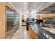Modern kitchen with stainless steel appliances, granite countertops, and bright natural lighting at 1484 Macdonald Ranch Dr, Henderson, NV 89012