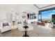 Bright living room with modern decor, comfortable seating, and large windows offering city views at 1484 Macdonald Ranch Dr, Henderson, NV 89012