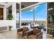 Bright living room featuring large sliding doors opening to an outdoor dining area with city views at 1484 Macdonald Ranch Dr, Henderson, NV 89012